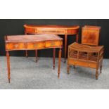 A George III style serpentine writing side table; a demilune side table; a tray top bedroom cabinet;