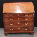 A 'George III' mahogany bureau, fall front enclosing a small door, pigeonholes and small drawers,