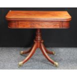 A 'George III' design mahogany tea table, hinged rounded rectangular top, ring-turned column,