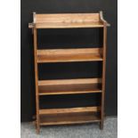 An early 20th century oak open bookcase