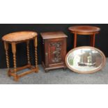 A Victorian oak pot cupboard, inset with an earlier carved fielded panel titled Africa, bun feet,