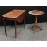 A George III mahogany Pembroke table, near-circular top with fall leaves,