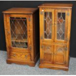 An Old Charm oak media/side cabinet; another,