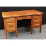 An early-mid 20th century oak writing desk,