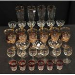 A set of 1950s lemonade glasses, engraved and applied with bands of gold; others similar,