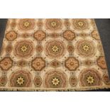 A carpet, woven throughout with Neo-Classical inspired motifs,