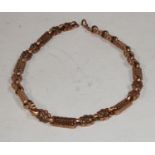 A fancy link rose gold coloured metal necklace, unmarked,(tests as 9ct gold) 46.5cm long, 46.