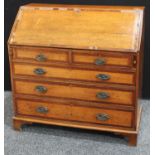 A 'George III' oak bureau,