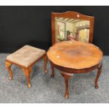 An early/mid 20th century walnut quarter veneered shaped circular coffee table;