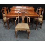 A Queen Anne design walnut dining suite, comprising well figured extending dining table,