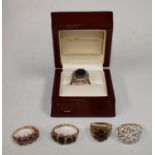 A 9ct gold cluster dress ring set with paste stones, two other 9ct gold rings, set with stones, 11.