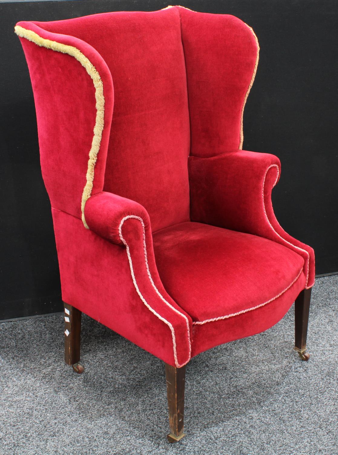 An early 20th century wingback armchair, scroll arms, stuffed over upholstery, 118. - Image 2 of 4