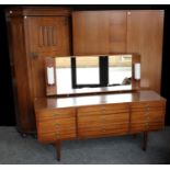 A retro mid-20th century dressing table; a conforming wardrobe; another, oak,