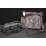 Luxury Fashion - an Italian brown ostrich skin lady's handbag, 31cm wide; another, black, 23cm wide,