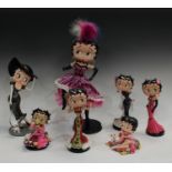 A Danbury Mint Betty Boop figure, Holiday Hottie, 24cm high; others similar, Enchanting Betty,