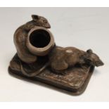 A cast resin inkwell, after Aigon, Les Deux Rats & L'oeuf, weighted,