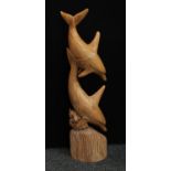 A floor standing mango model, carved as a pair of dolphins,