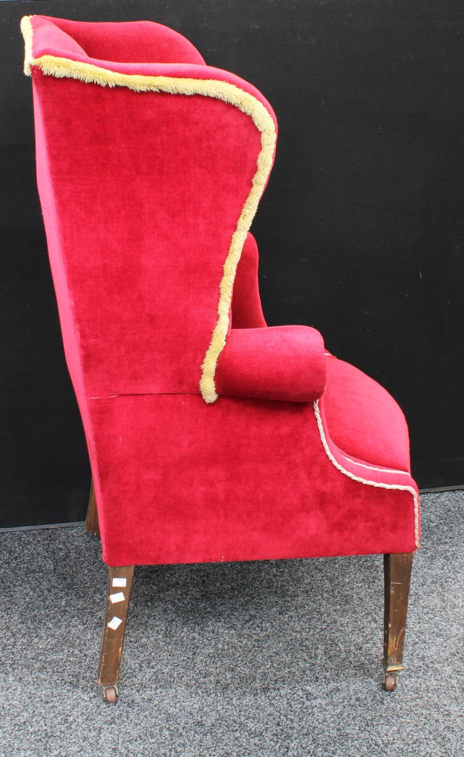 An early 20th century wingback armchair, scroll arms, stuffed over upholstery, 118. - Image 3 of 4