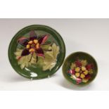 A Moorcroft Clematis pattern bowl, 11cm diam. impressed mark; a similar plate, 18.