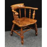 A Country House elm smoker's bow elbow chair,