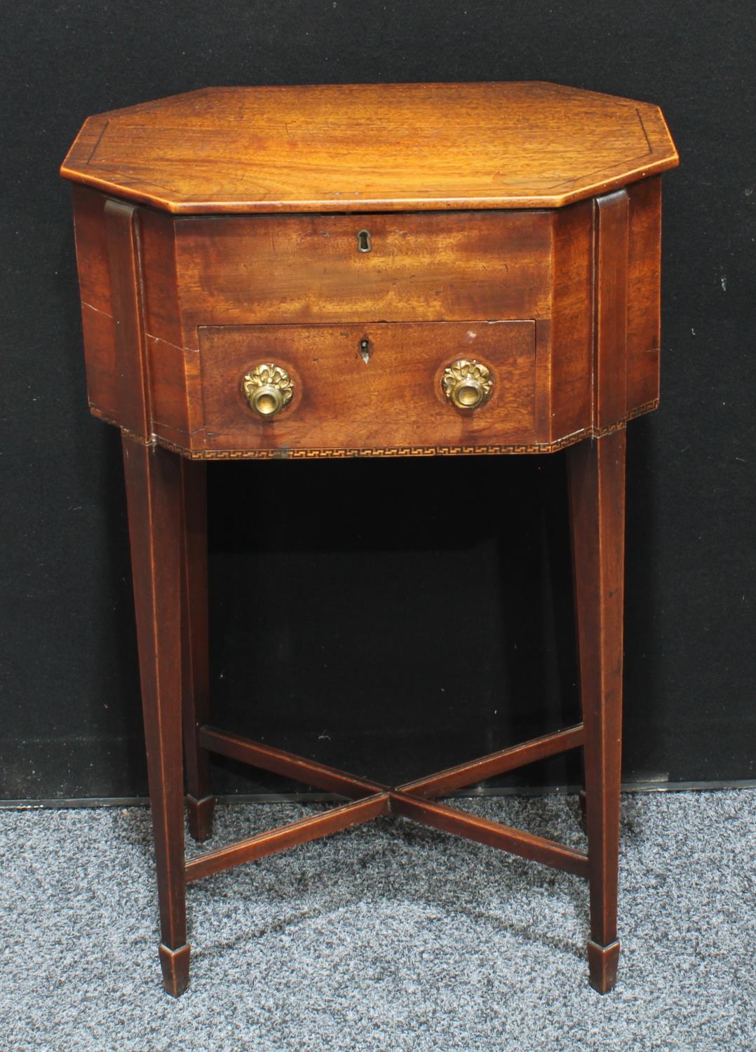 A 'George III' mahogany octagonal work table, hinged top enclosing a pair of removable trays,