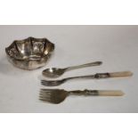 A pierced silver octagonal dish, 89.7g, marked "Silver"; a silver spoon, similar, 36.