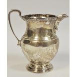 A silver cream jug, Adie Brothers ltd, Birmingham, 1936 131.