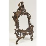A large Art Nouveau cast metal cartouche shaped easel frame surmounted with stylised young lady