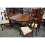 A mahogany oval windout dining table, gadrooned border, deep frieze, cabriole legs,