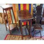 An early 20th century oak torchère or jardiniere stand; a carved oak spinning chair;