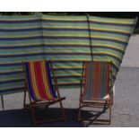 Two vintage deck chairs and a wind break