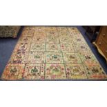 An Indian patchwork wall hanging/throw formed of thirty (5x6) bordered squares,