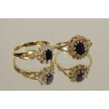 A 9ct gold sapphire and diamond cluster ring, diamond chips set in shoulders 2.