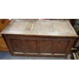 A Charles II oak four panelled blanket chest, hinged top above a nulled frieze, stile feet,