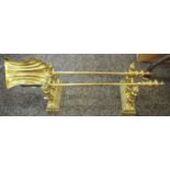 A pair of Victorian brass andirons, fluted bases; a two piece fireside companion set,