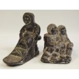 Two Canadian Innuit carvings of a man on sleigh and children in traditional dress