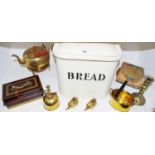 A brass kettle; kettle stands; elephants; candlestick; an enamelled bread bin; a money box;