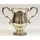 A silver twin handled baluster shaped cup,