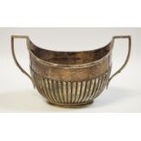 A silver twin handled boat shaped sugar bowl, half ribbed, William Hutton & Sons, Sheffield,