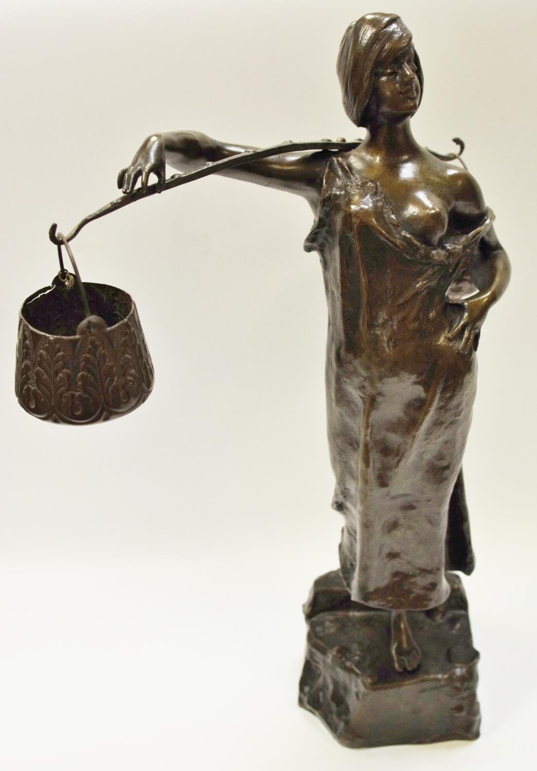 A Bronze Figure - Water carrier,