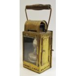 An Osmeka German railroad carbide lantern, brass body, clear glass with shutters to sides.