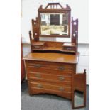 An Arts and Crafts mahogany dressing chest, shaped and pierced pediment and uprights,
