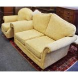 A modern two seat sofa and conforming armchair.