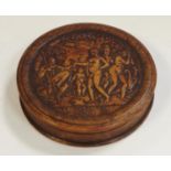 A French pressed walnut circular snuff box, circa 1820.