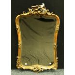 A late 19th century Rococo style gilt cartouche shaped mirror,