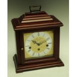 A Hermle bracket clock, Westminster chime, silvered chapter ring with Roman numerals,
