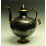 A substantial Indo-Persian steel and brass wine pot,