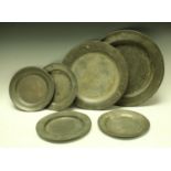 A quantity of 18th century pewter, including two chargers and four circular plates, c.