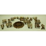 A golf game, Roman numeral cast metal markers with putting hole,