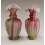 A pair of ovoid cased glass rainbow vases, fluted everted rims, 17.